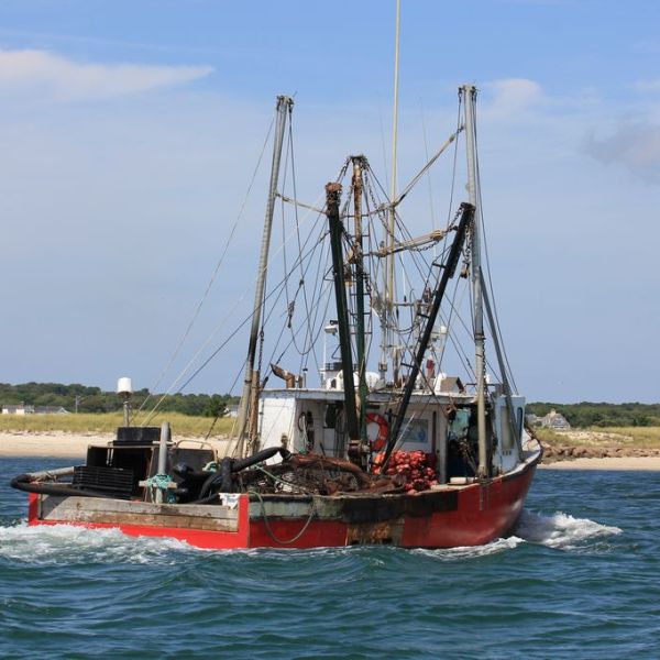 a small boat in a large body of water